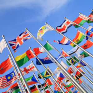 A range of World flags on poles reaching to the sky