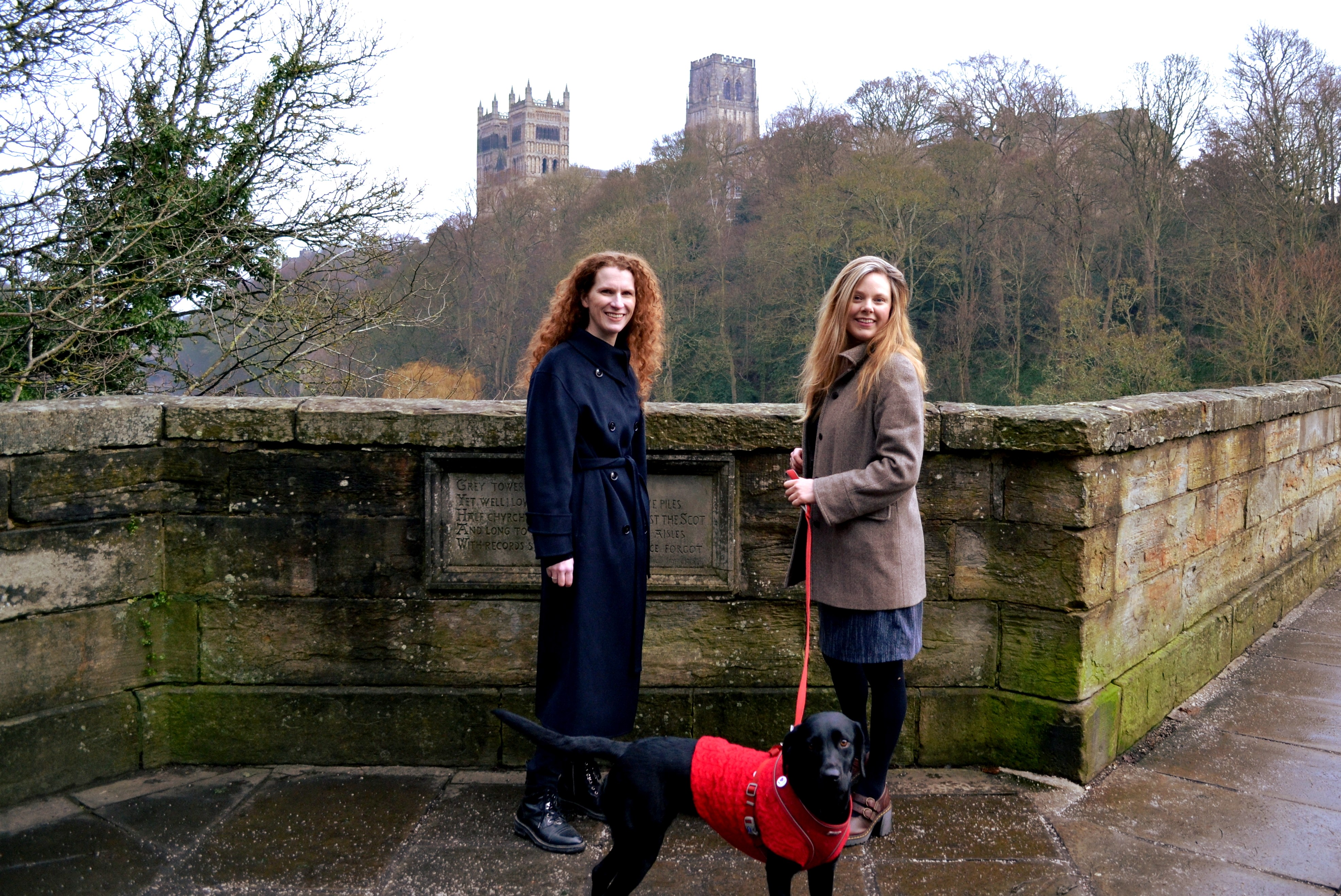 The legacies team stand on the prebends bridge. Durham cathedral is in view behind