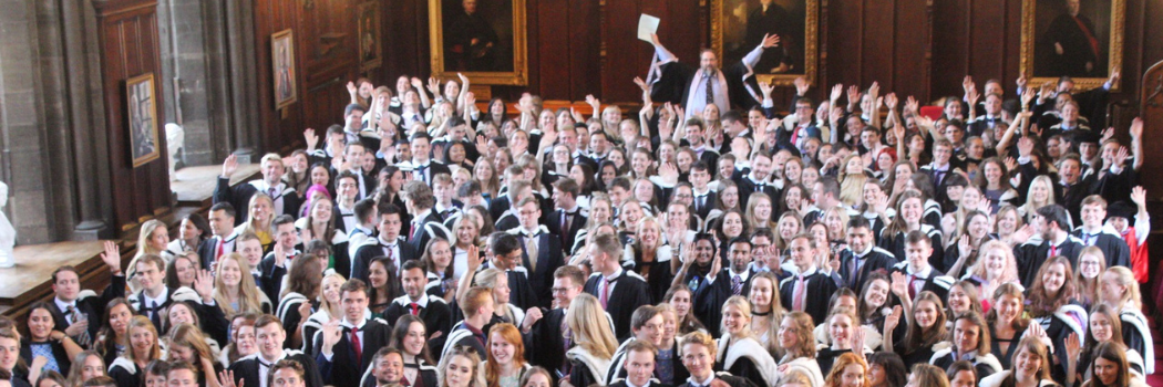 Grant Slater in Great Hall with graduating students