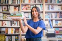 student holding book