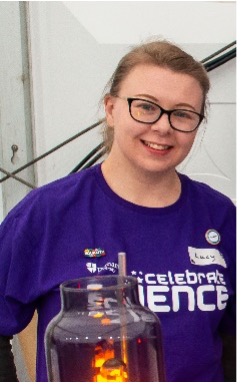 Photo of Lucy Downes taken at Celebrate Science (she is wearing a purple Celebrate Science t-shirt)