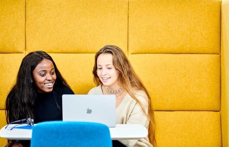 Two Students looking at laptop