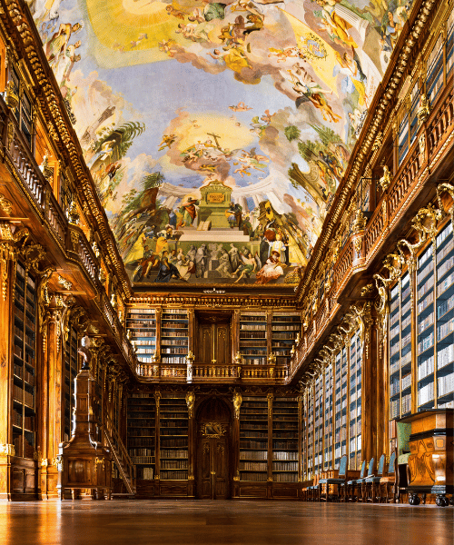 An historic library with a fresco ceiling