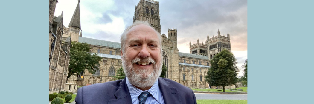 Bart de Jong smiling outside of Durham Cathedral