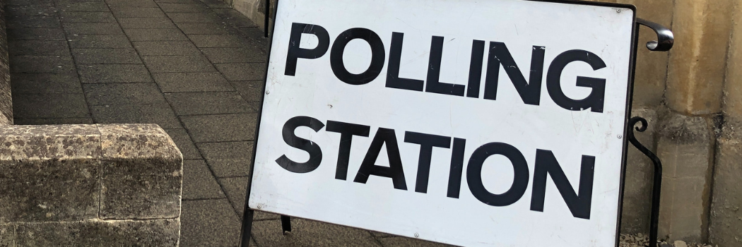 TPolling station sign outside of building
