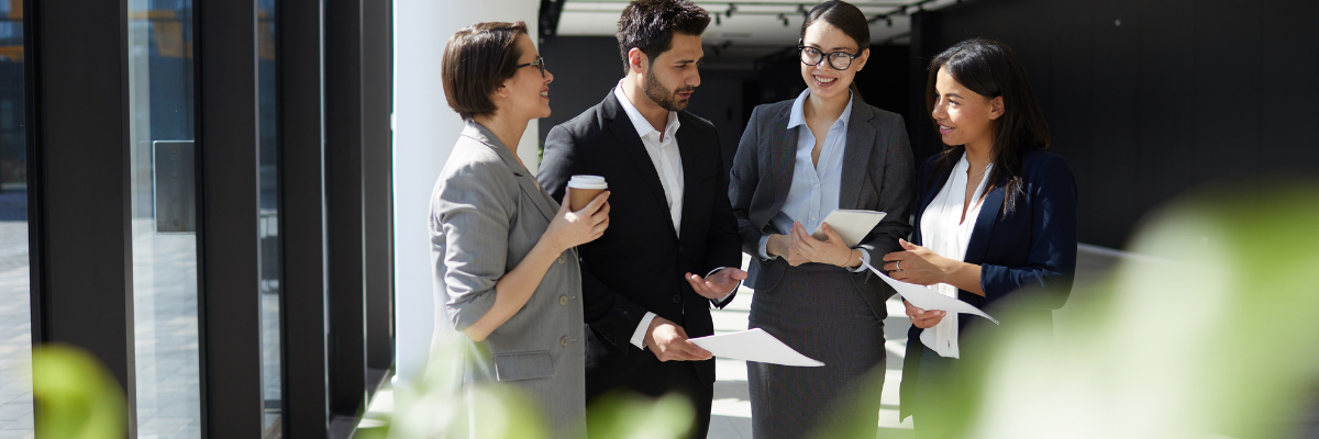 Entrepreneurs standing and talking over coffee