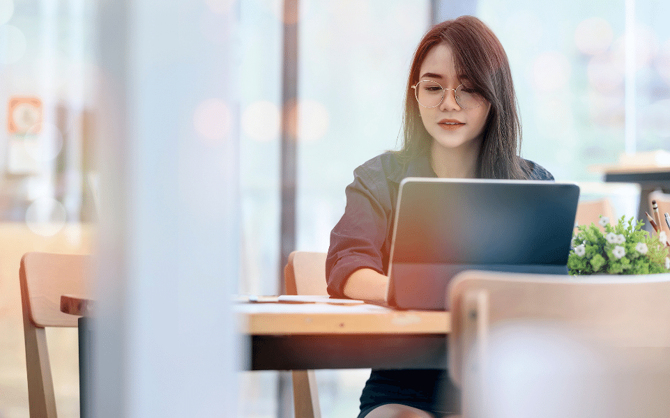 Female typing on a laptop