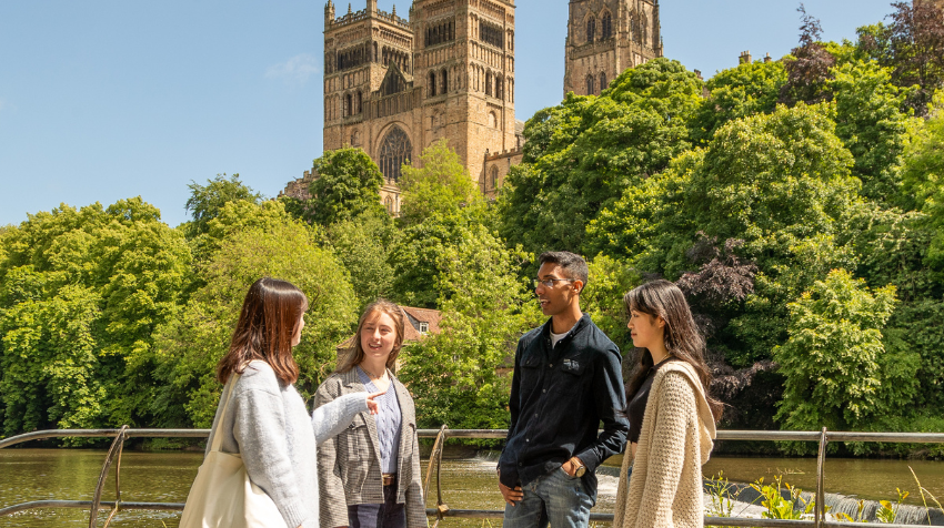 Students stand by river wear