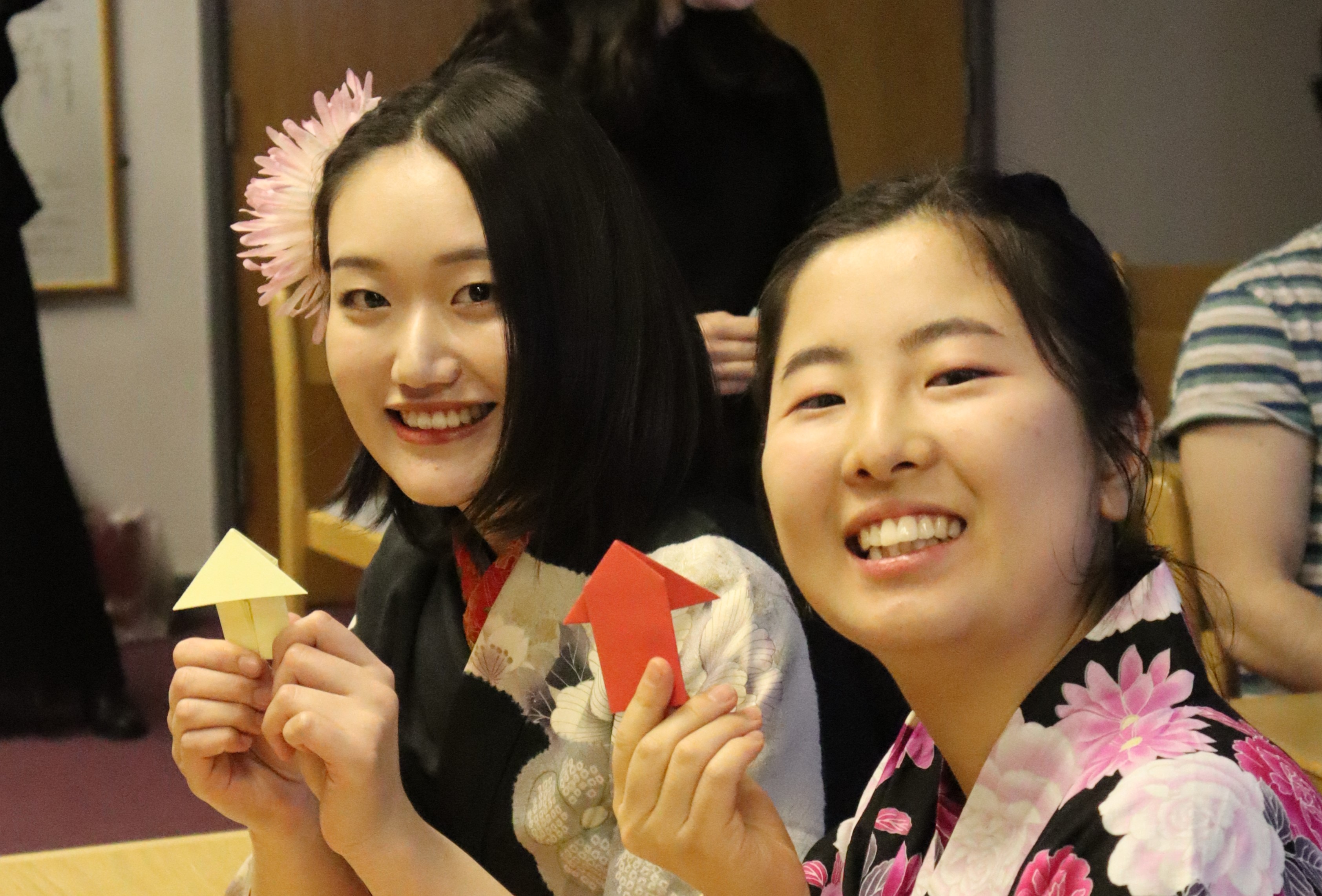 Students holding origami at the Japanese Language Encounters event, part of Global Week 2023