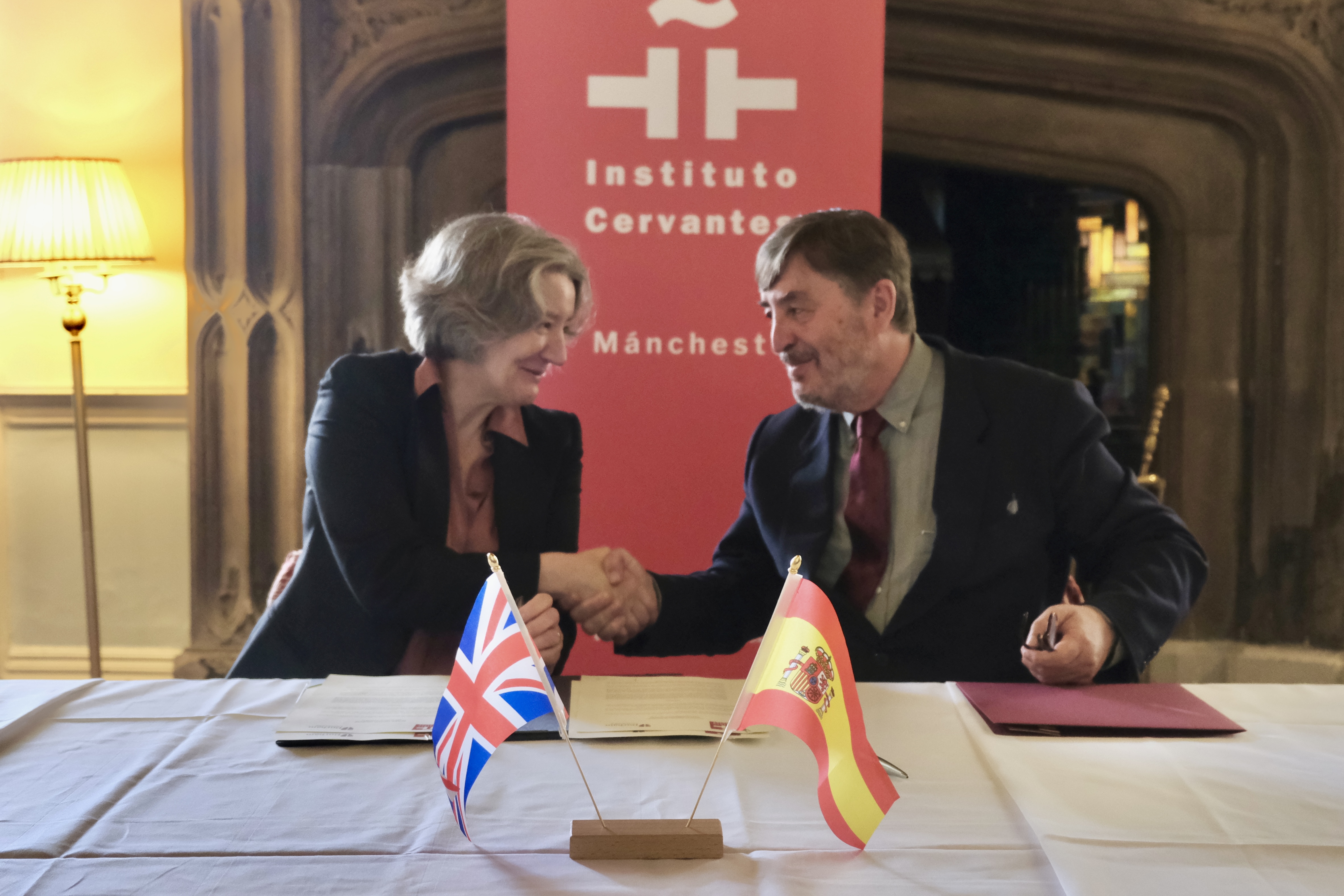 Professor Karen O'Brien and Professor Luis García Montero shaking hands after signing a MoU (Memorandum of Understanding) between Durham University and Instituto Cervantes.