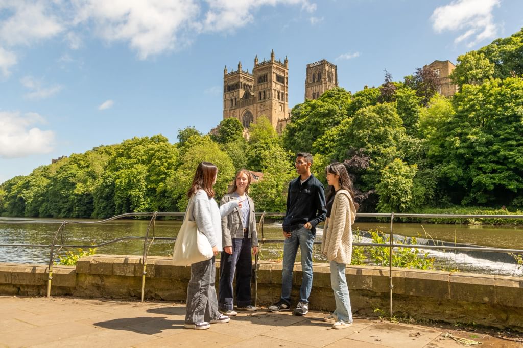 Students by the river talking