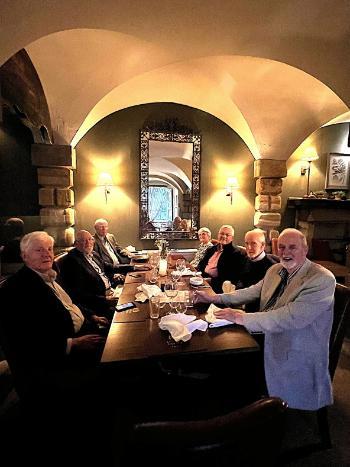 group of kings college alumni having dinner
