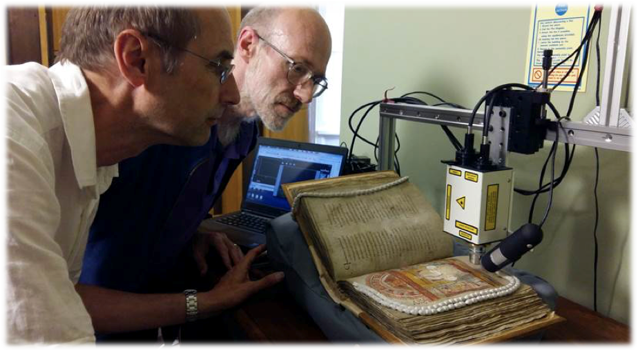 Professor Richard Gameson and Professor Andrew Beeby looking at medieval books