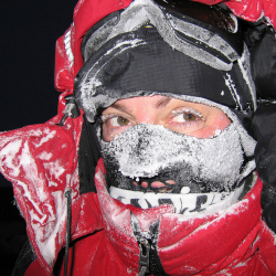Sue Flood face in ski coat and hat with snow