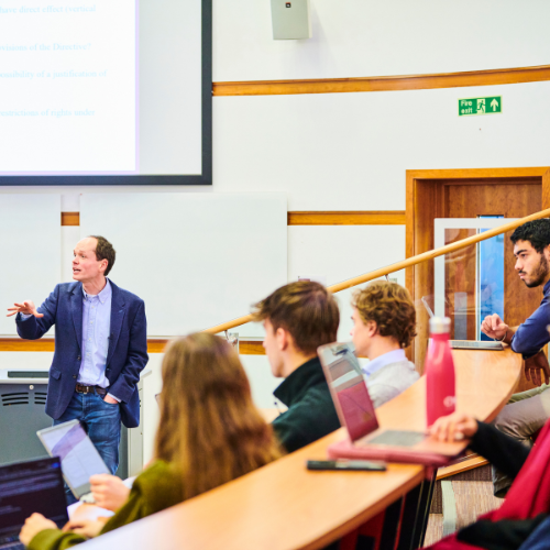 Students listening to lecturer in a lecture theatre