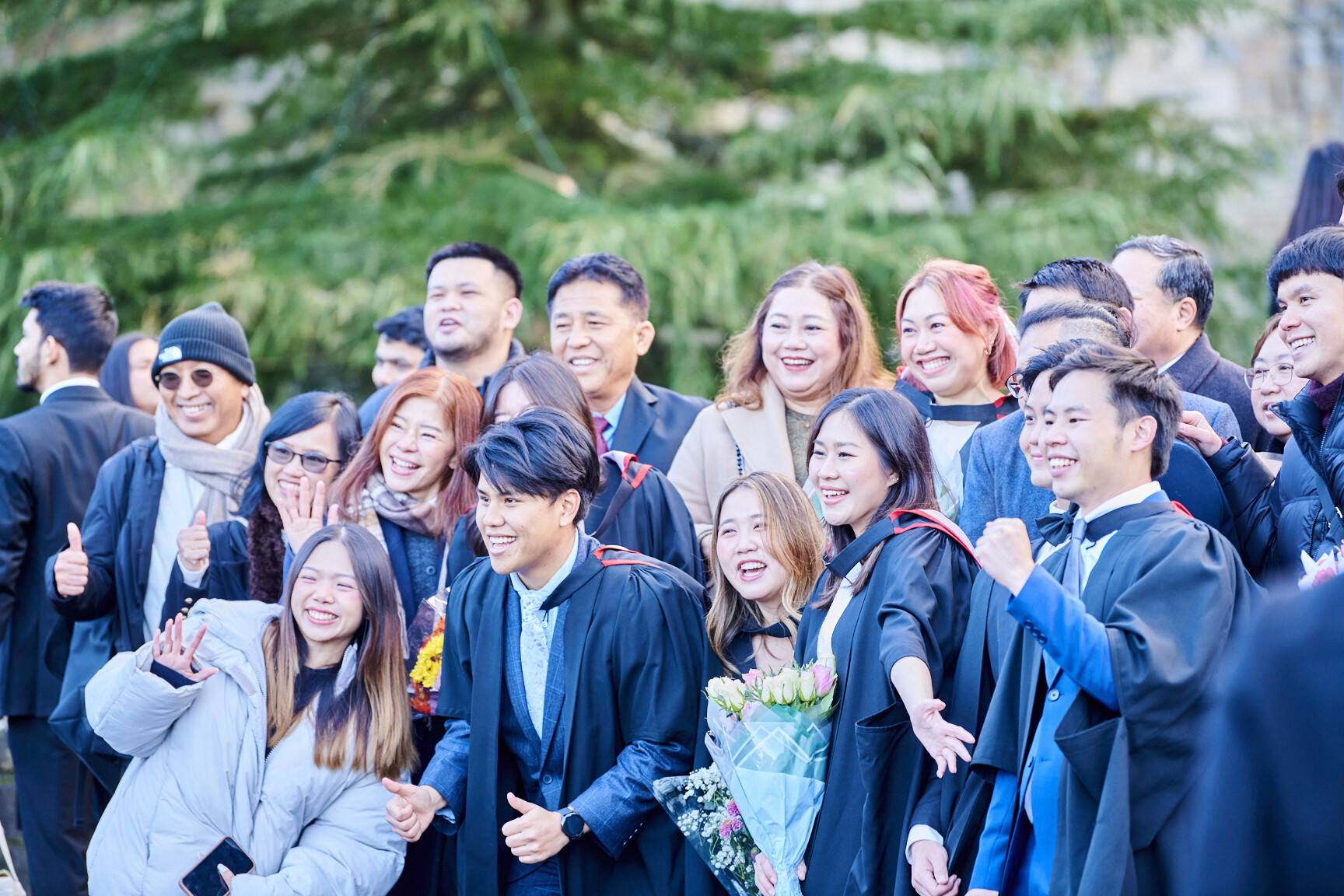 A group of international DUBS students celebrating Congregation