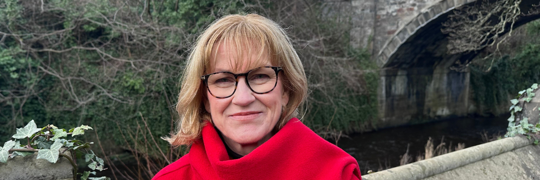 Professor Clare McGlynn photographed outside smiling to camera