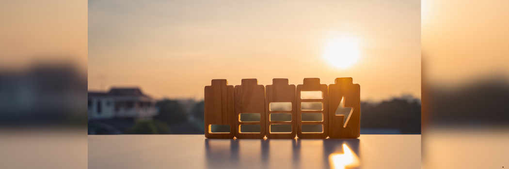 Image of sunrise and wooden battery shapes