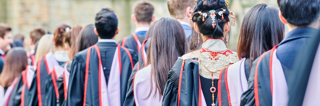 Students from behind in procession for graduation