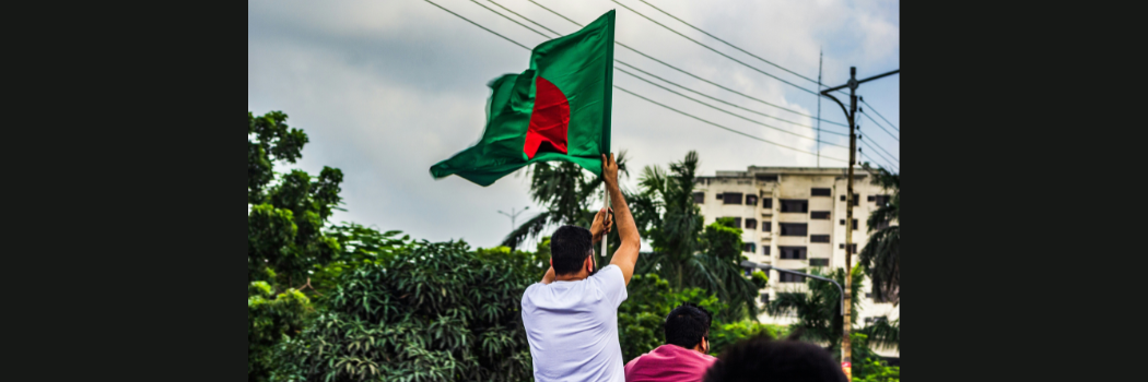 A man waving the flag of Bangladesh