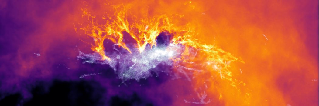 A computer simulation image showing stars and gaseous material in a simulated ultra-faint dwarf galaxy in yellow, orange, purple and pink colours.