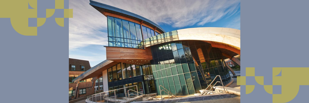 An external view of Durham Law School, a wooden beamed, glass-fronted building.