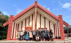 A group of people standing in front of a building