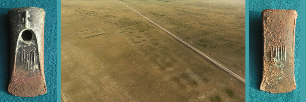 An aerial view of the site, showing a desert-like landscape with ridges.