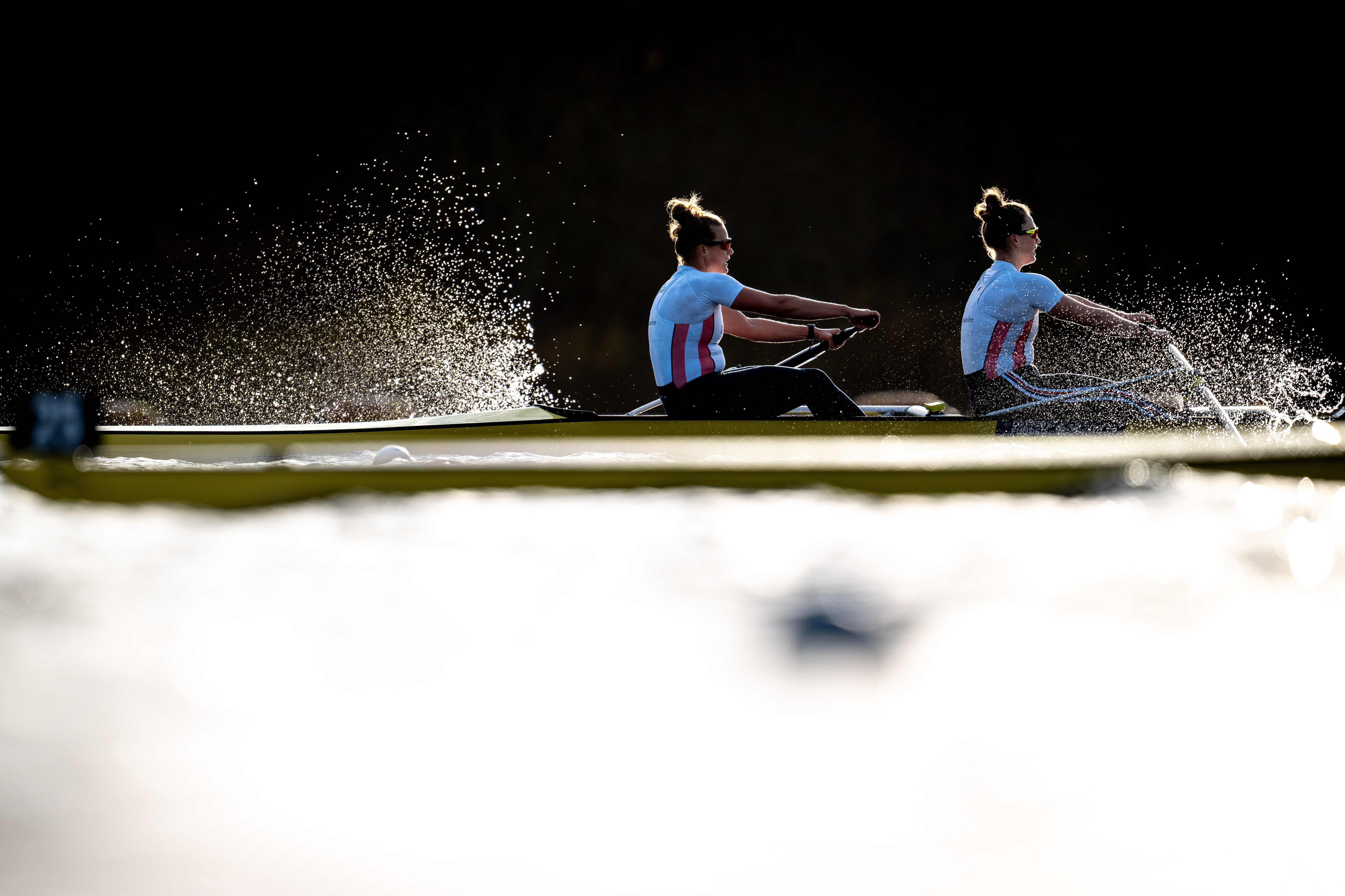 Two women in a rowing boat on the water