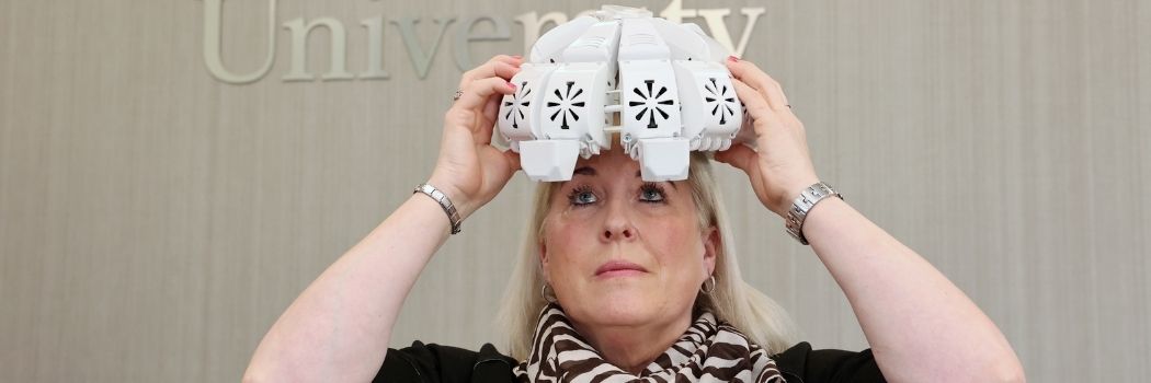 Tracy Sloan, who took part in a trial study to test the effectiveness of the infrared light therapy helmet she is wearing.
