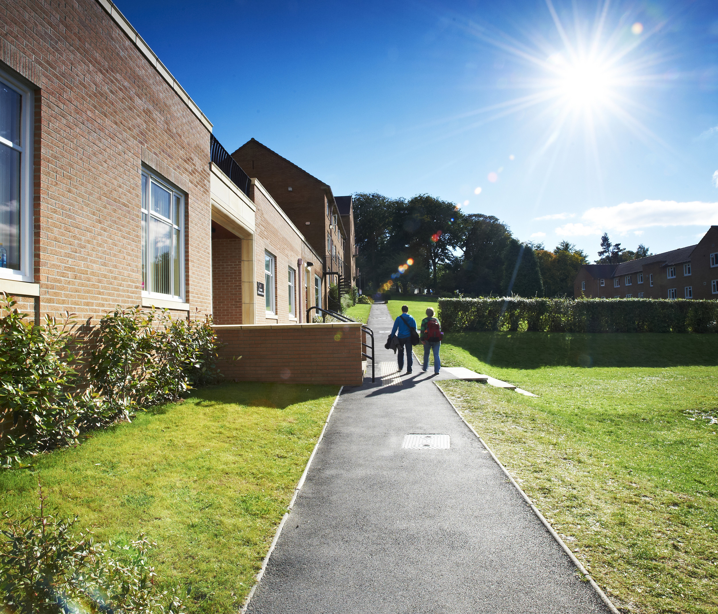 Two students walking outside Grey College