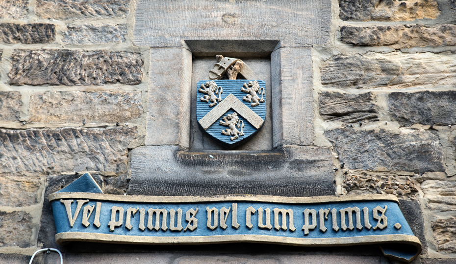 The college crest and motto above the entrance to the college
