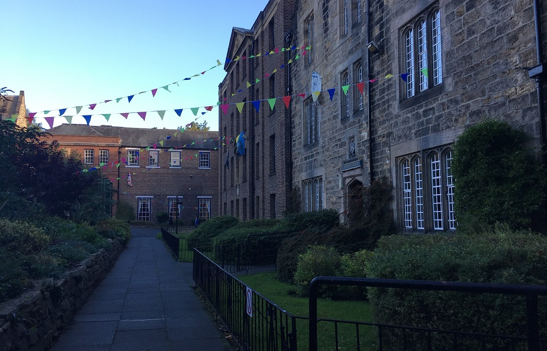 Hatfield College Grounds hung with multi-coloured bunting