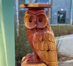 A picture of the South College Mascot, Oswald T Owl. Oswald is a wood carved owl.