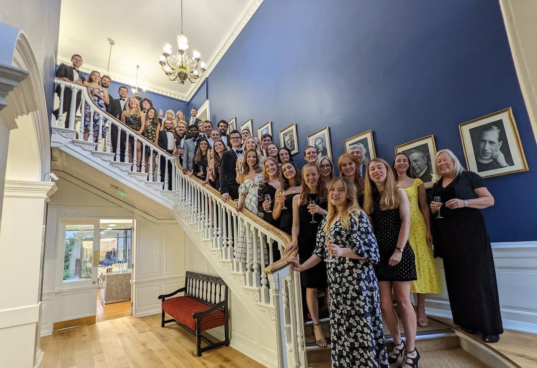 A photo of St John's alumni gathering on the Haughton staircase.