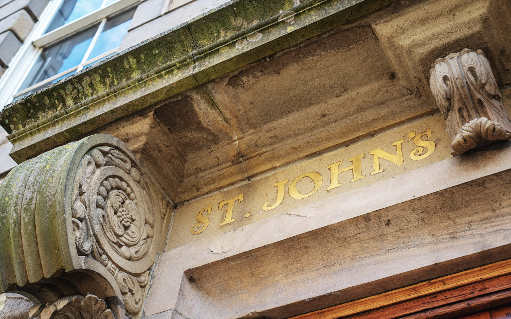 TGold lettering on St John's College exterior