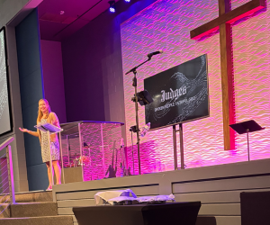 Courtney Vereide on stage, preaching