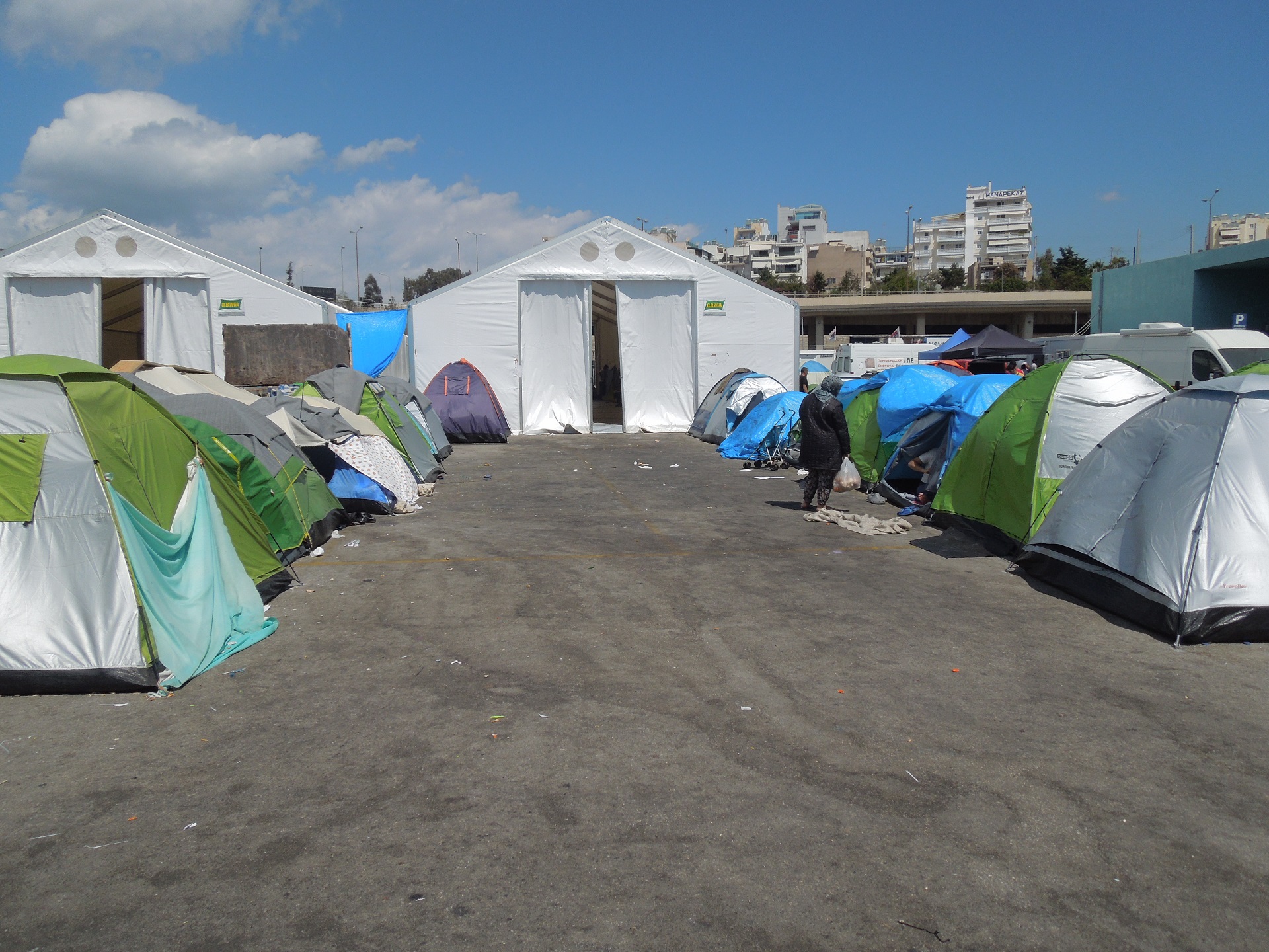 Several small tents in a migrant camp