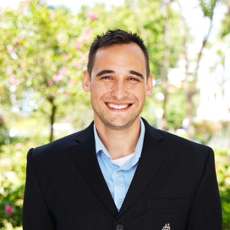 A man smiling at the camera