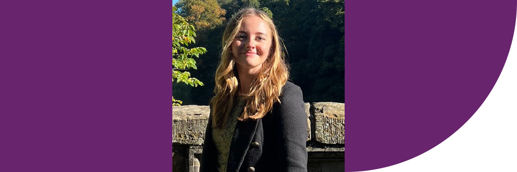 Student standing on bridge