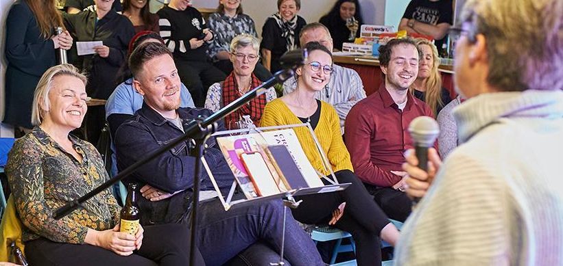 People laughing in an audience