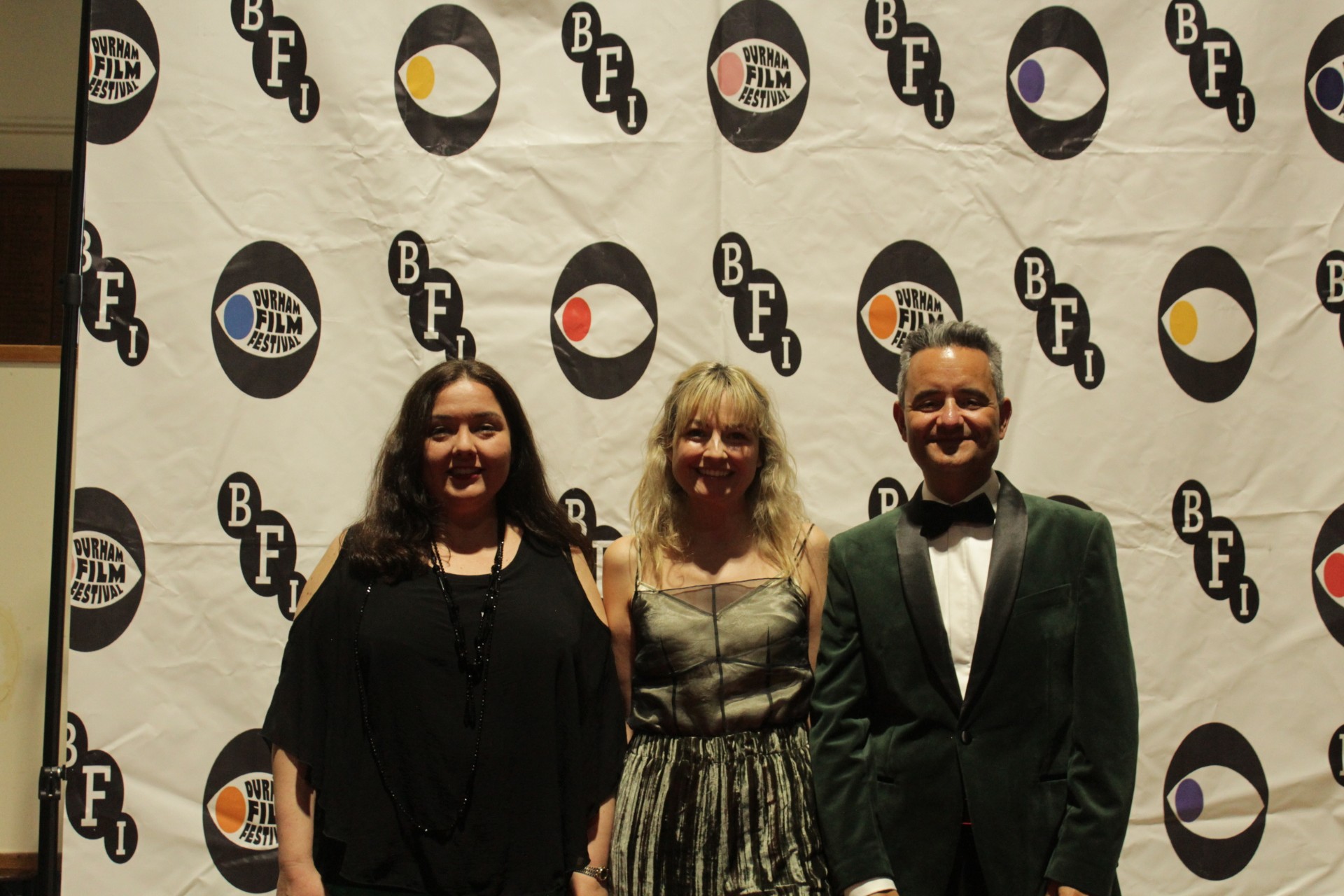 three people standing before the BFI logo