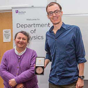 Photograph of Willem receiving his award, presented by Paula Chadwick.