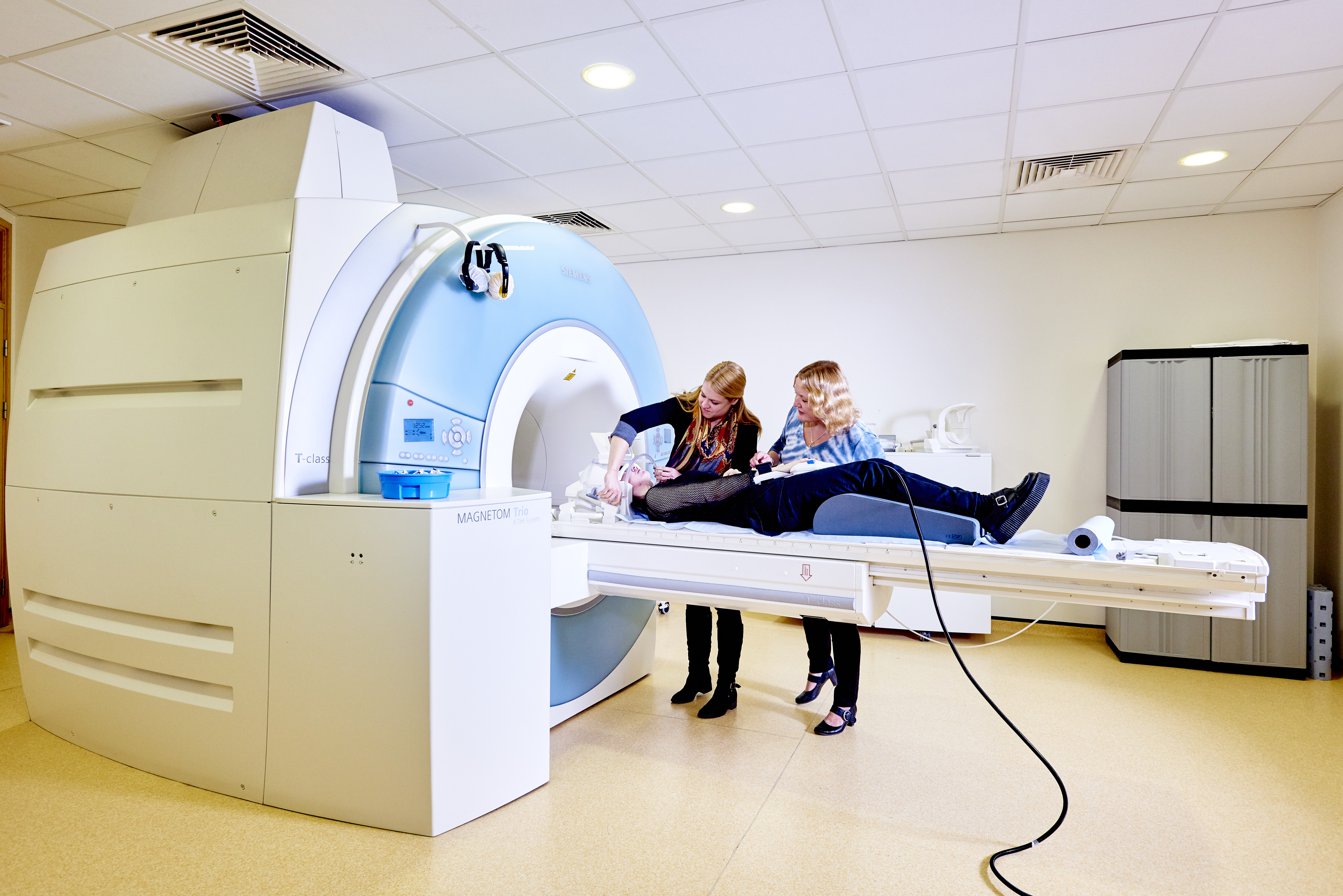 Postgraduate student and supervisor setting up fMRI at James Cook Hospital