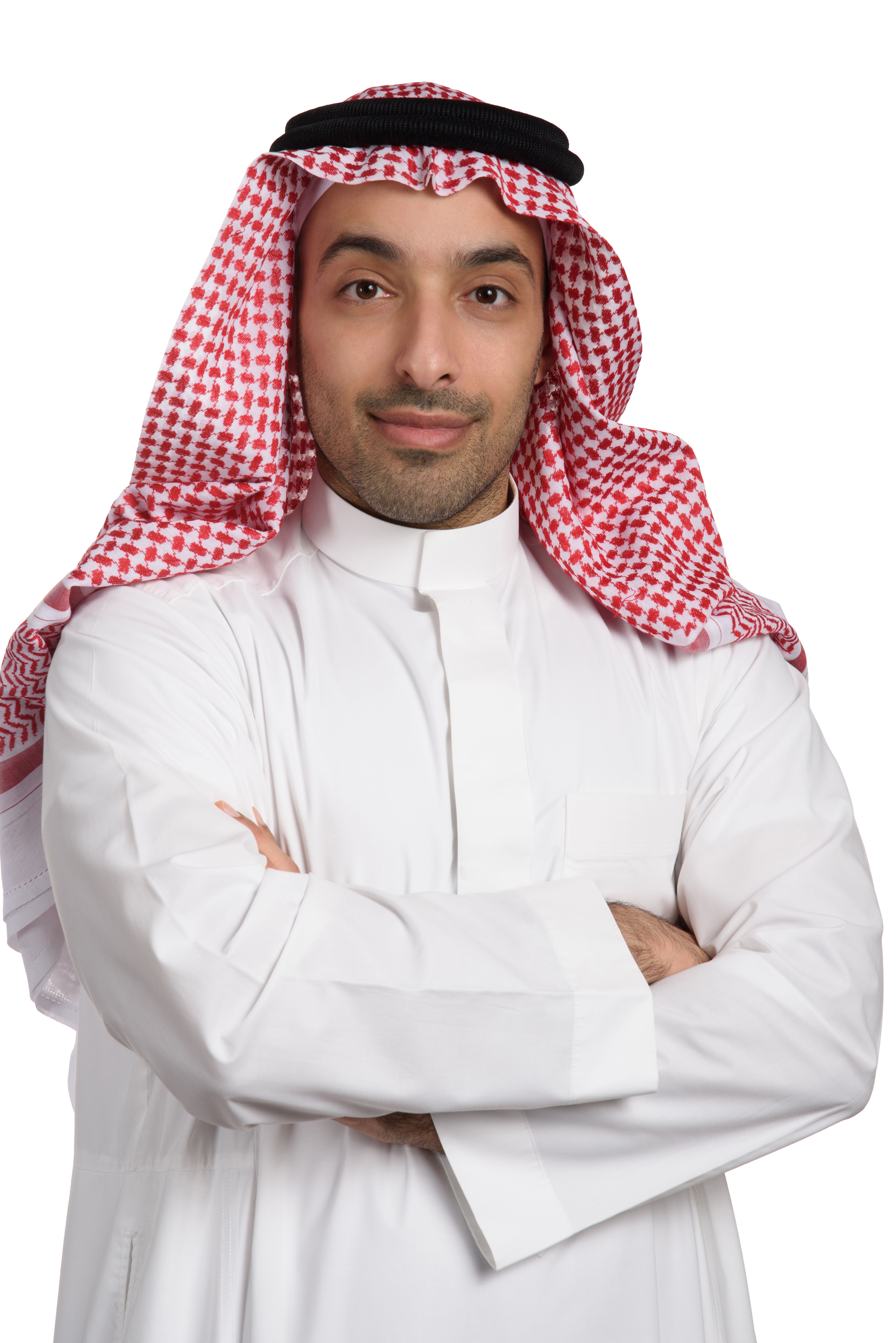 A man wearing a white thawb and red and white ghutrah.