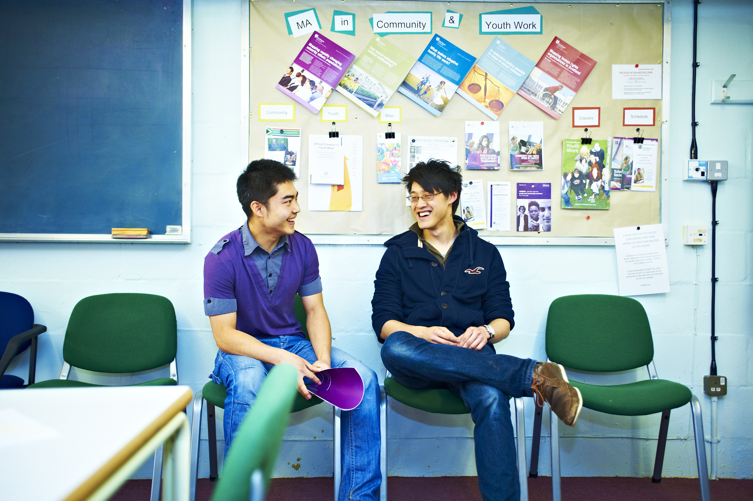 Two students in conversation during a seminar