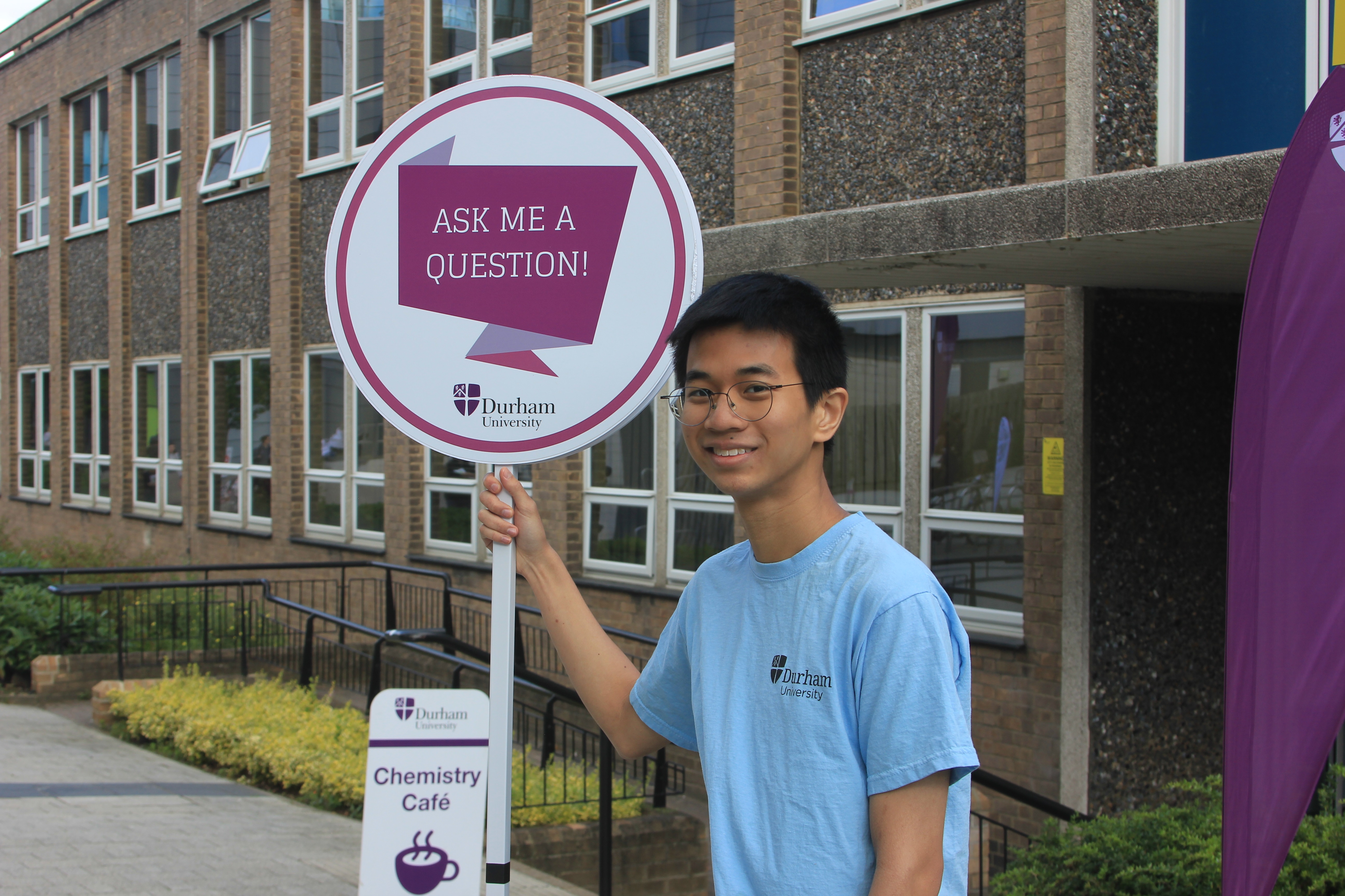 A student holding a sign