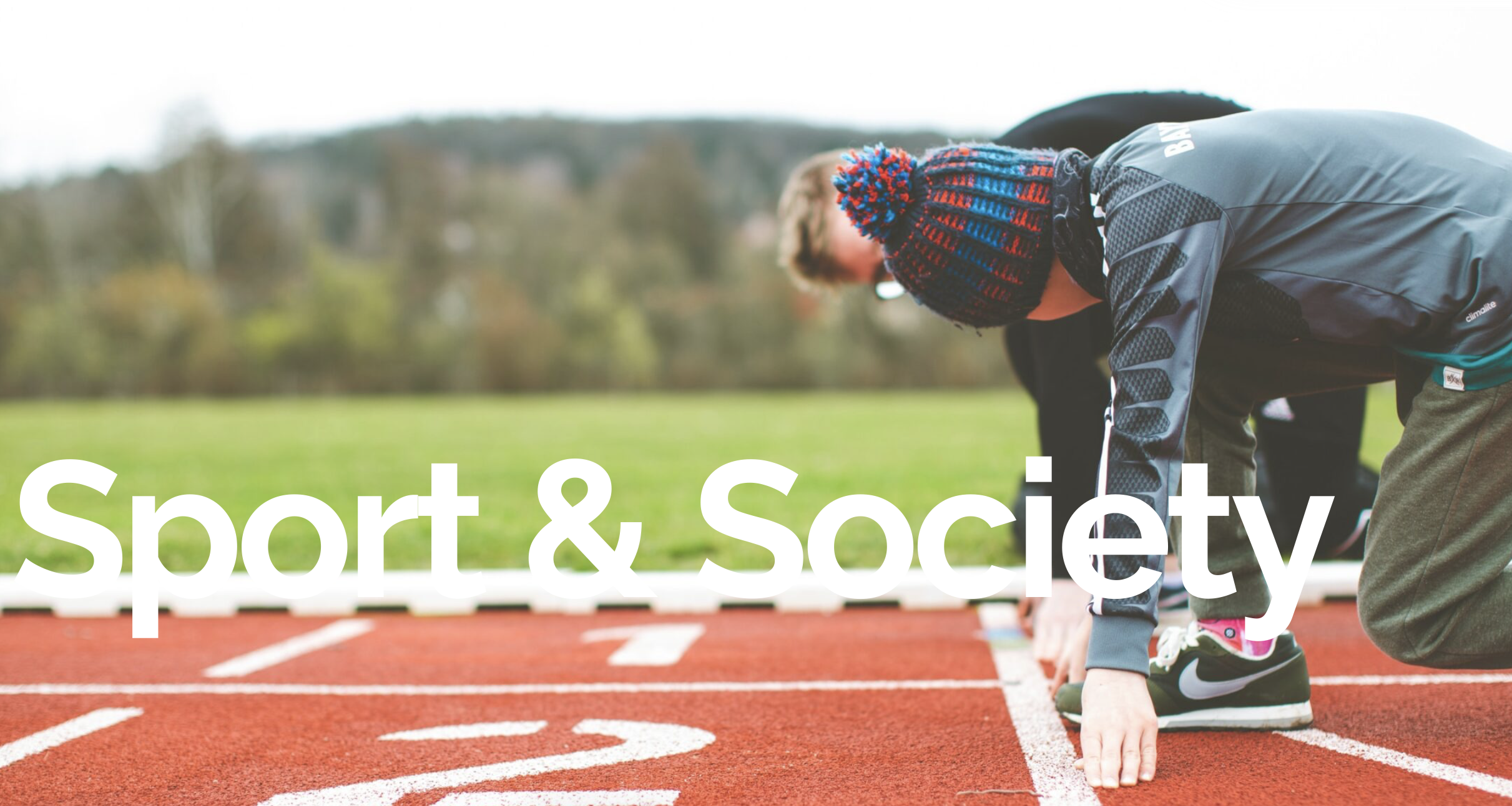 Two individuals taking their places at a starting line with the words Sport and Society layered across.