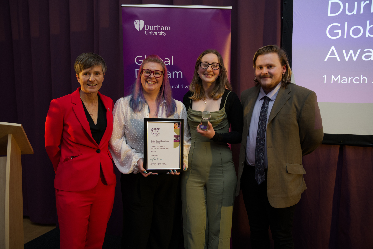 Lynsey Drinkhall and her student coordinators team receiving the Global Student Experience Award (Staff)