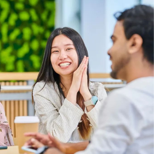 Two students chatting over coffee